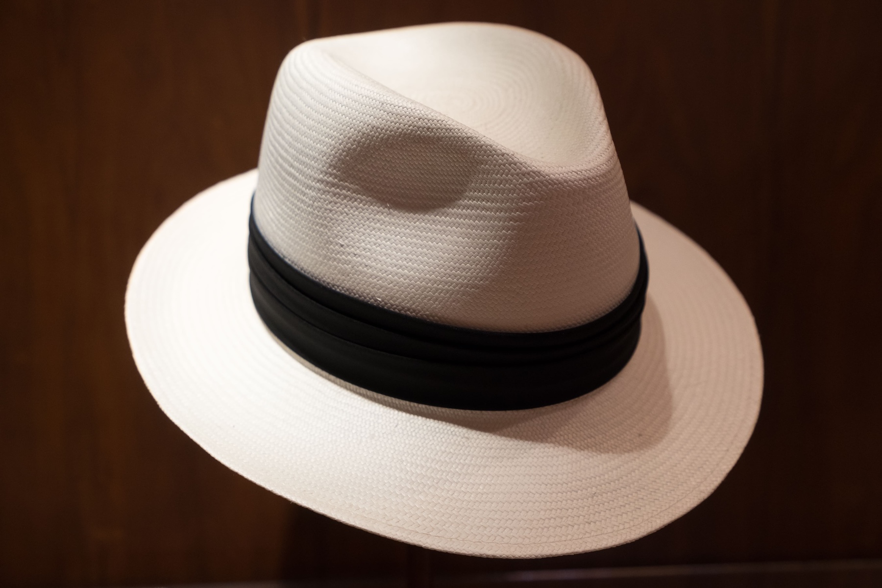 Traditional white Panama hat with black band from Ecuador